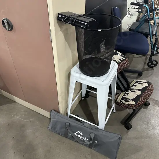 Bar stool, rubbish bin, camp bed, free view