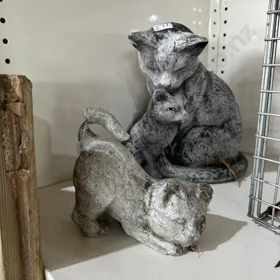 2 concrete garden cats