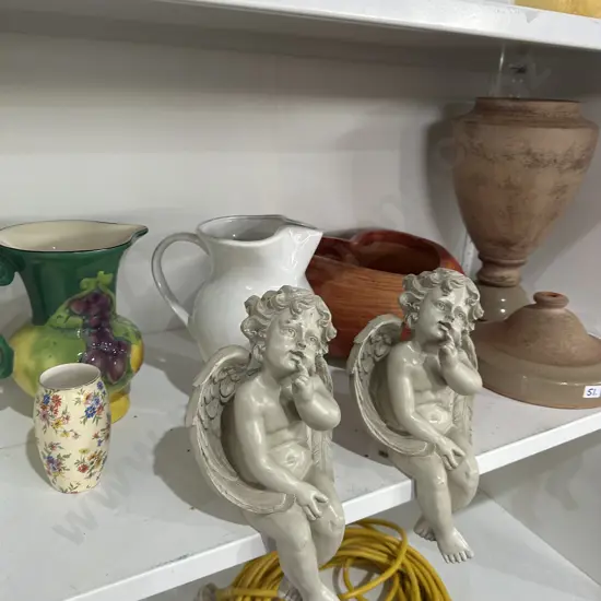 Shelf lot including Cupids