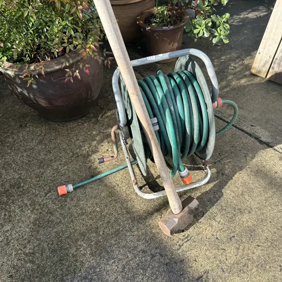 sledge hammer and hose reel