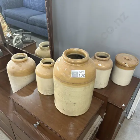 Stone crocks, some with damage