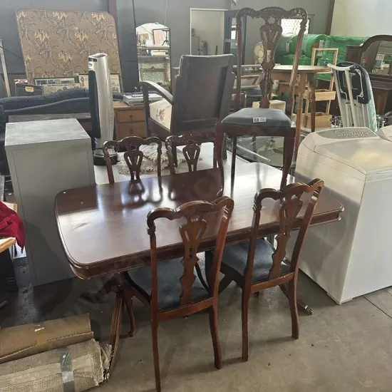 Twin pedistal table and 5 carved wood chairs