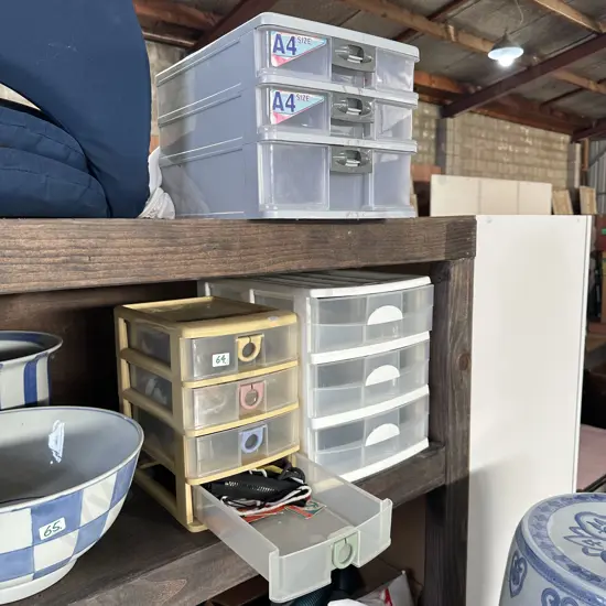 Three plastic drawers and contents