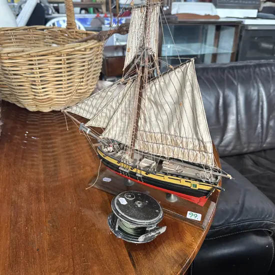 Fly reel and model boat