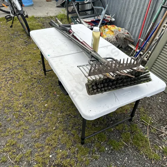 camping table and garden tools