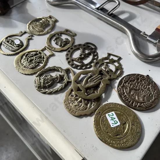 Horse brasses, medal and badge