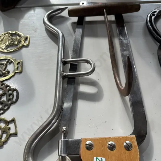 meat hook, hanger and saw