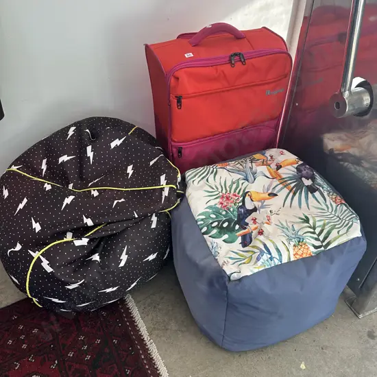 2 bean bags and suitcase