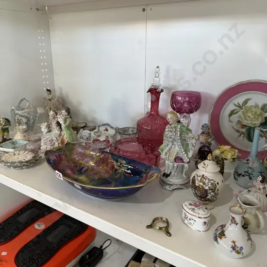 Shelf of collectables inc Cranberry glass