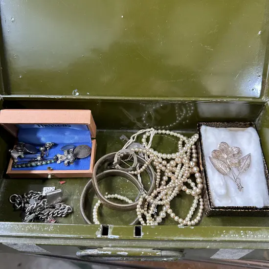 Cash tin of jewellery