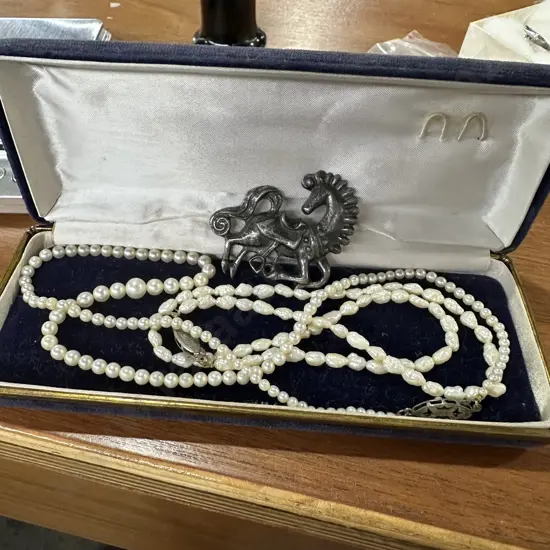 2 sets of Pearls and brooch