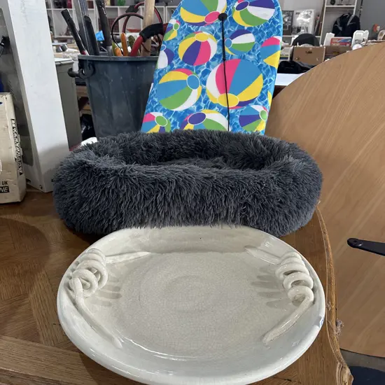 large pottery platter, bogey board, pet bed