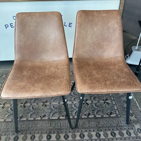 Pr of distressed leather style chairs