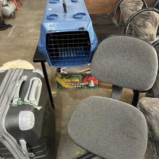 pet cage and office chair