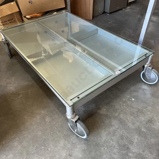 Industrial style mobile coffee table with pull out magazine drawers