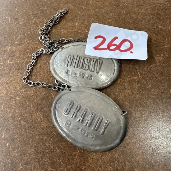 Whisky & Brandy labels, hallmaked with a Tiki & Lion.....