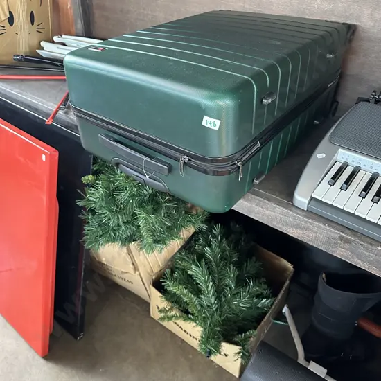 xmas tree, bike rack, foot brace, roll and suitcase with missing wheel