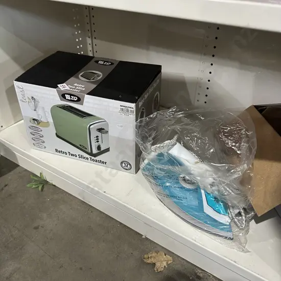 Boxed new toaster and steam iron