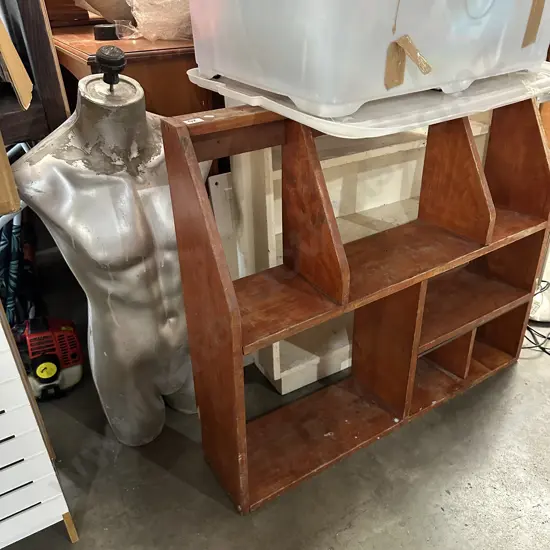 2 wooden shelves and mannequin