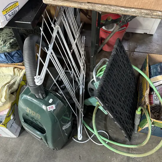 vac, hose, clothes horse, door mat
