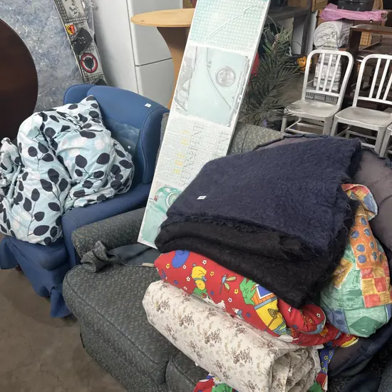 bedding, folding chair and picture