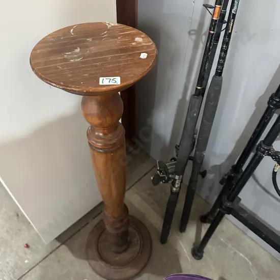 fishing rods and plant stand