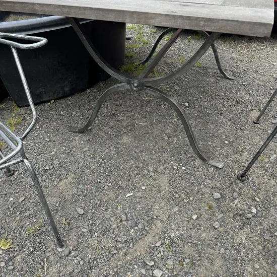 Outdoor forged steel based table and 4 carver chairs  (2 photos)
