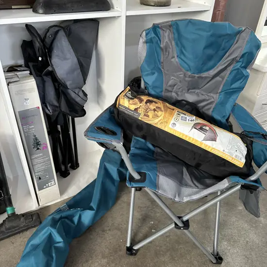 Tent, folding chairs, xmas trees