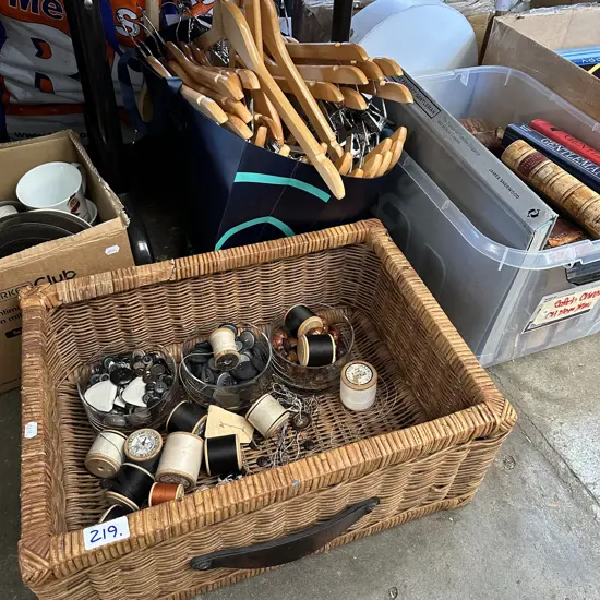 Basket of Vintage cotton reels and buttons plus bag of coat hangers