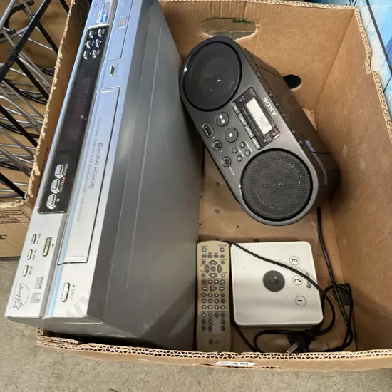 Portable Sony radio/compact disk player and VCR/DVD combo player