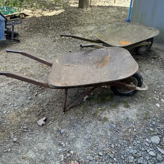 2 vintage wheel barrows (one broken handle)