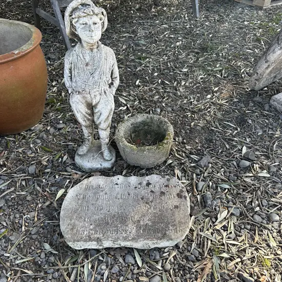 garden statue (repaired), plaque and planter