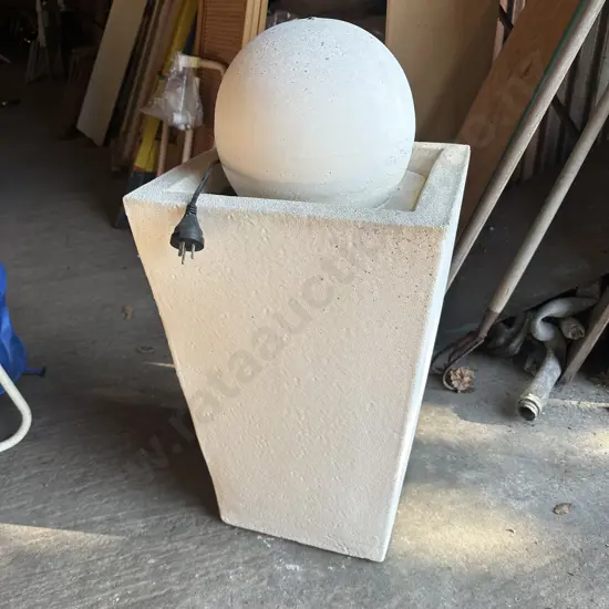 Concrete water feature with pump