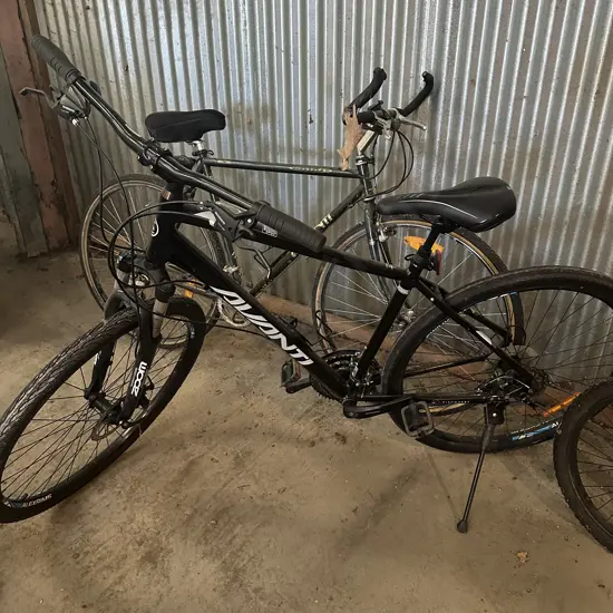 2 adult bikes (derailer bent on front bike)