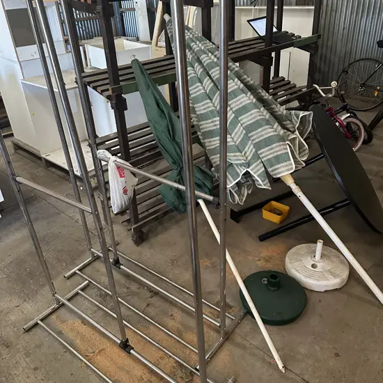 2 racks, 2 umbrellas and round table