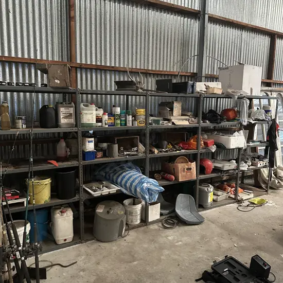 large steel shelf unit and contents