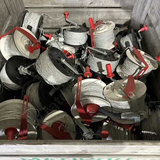 Over 50 electric fence reels, 2 bins of standards, 8 power units