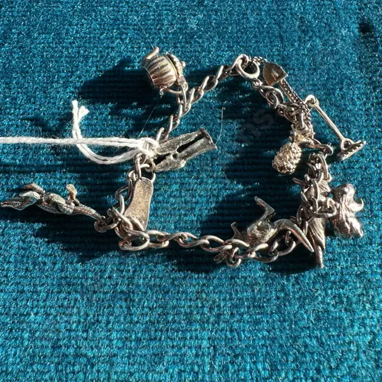 Charm bracelet - some Sterling Silver