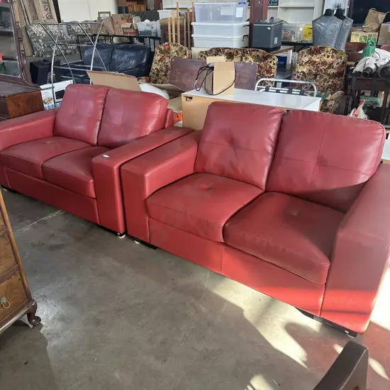 Pr of tidy Red leather sofas