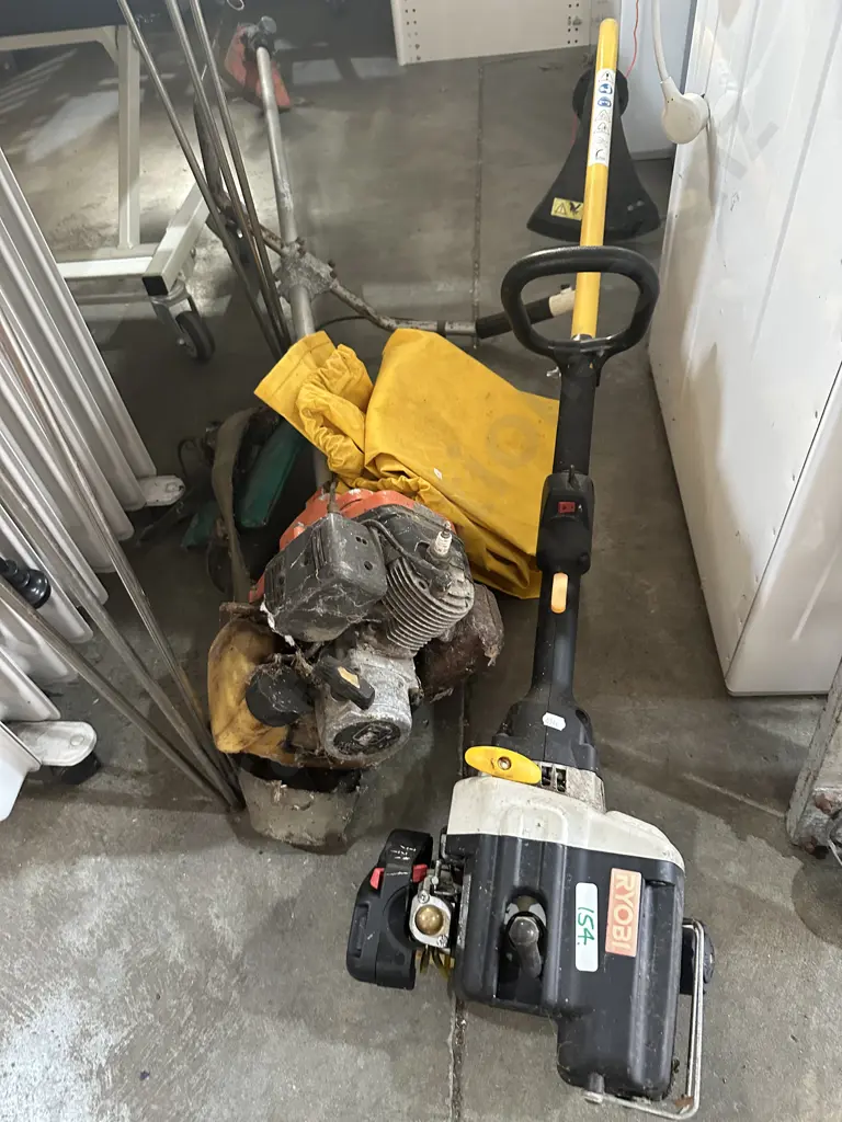 2 strimmers, one sold as working (plus wet weathers) Image 1++