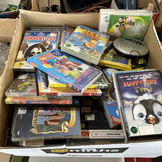 Box of VHS videos and DVDs etc.