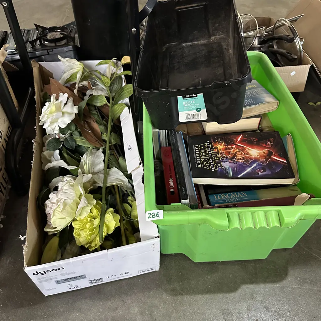 Bin of books plus plastic flowers Image 1++