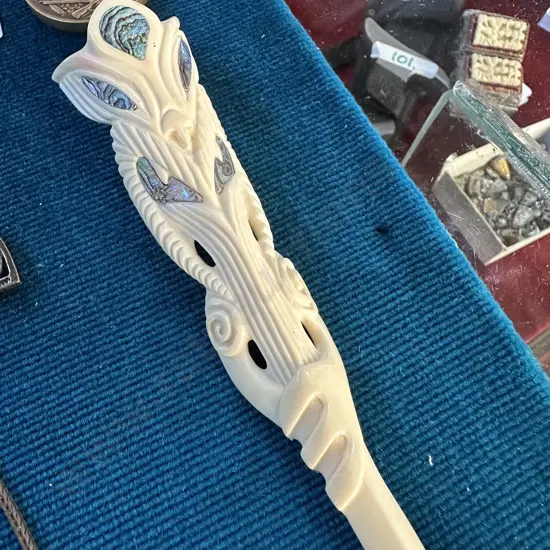 Maori bone carving with paua insert