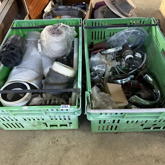Two bins of plumbing items