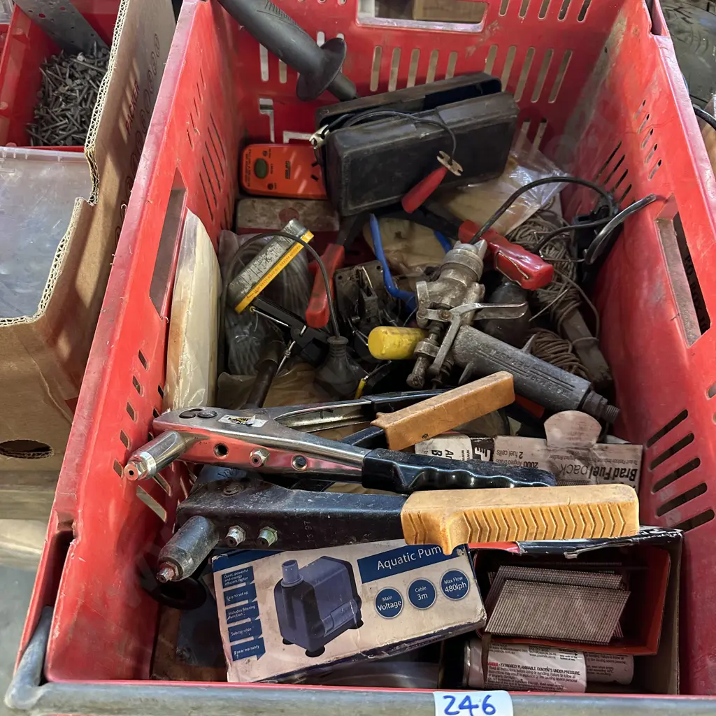 Bin of rivet guns, 12v chainsaw sharpener, pump, nail gun brads etc. Image 1++