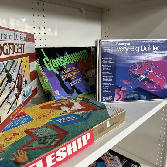 Shelf lot of games.