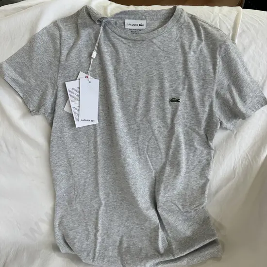 Lacoste M/$100