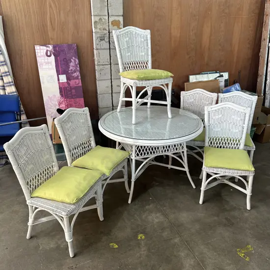 Very tidy wicker/cane patio table and 6 chairs