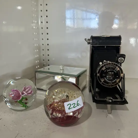 Jewellery box, camera and paper weights.