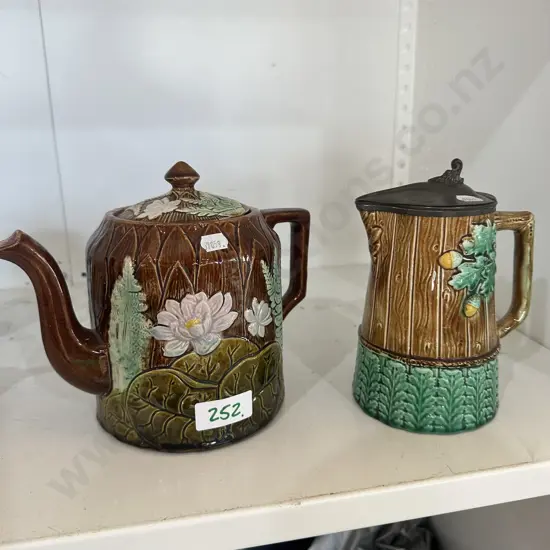 Majolica tea pot and pewter lidded jug.